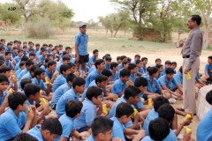 Principal-addressing-the-children-at-Pahari-Temple